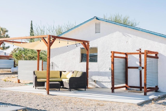 back of property with outdoor lounge area