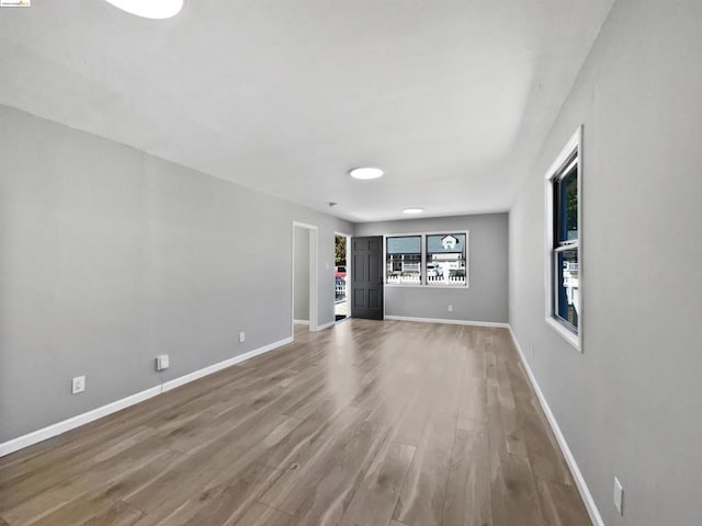 spare room with hardwood / wood-style flooring