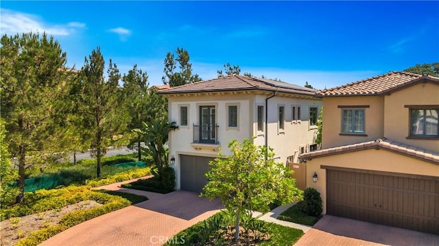 mediterranean / spanish house with a garage