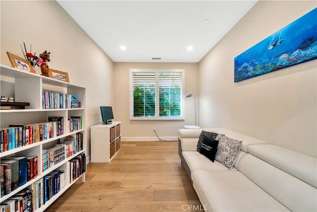 sitting room with light hardwood / wood-style floors