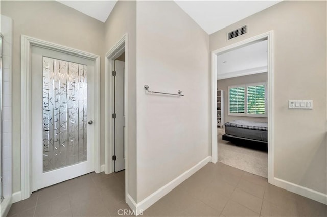 hallway featuring tile patterned floors