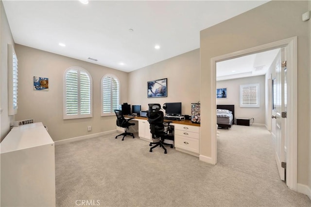 carpeted office space featuring a healthy amount of sunlight