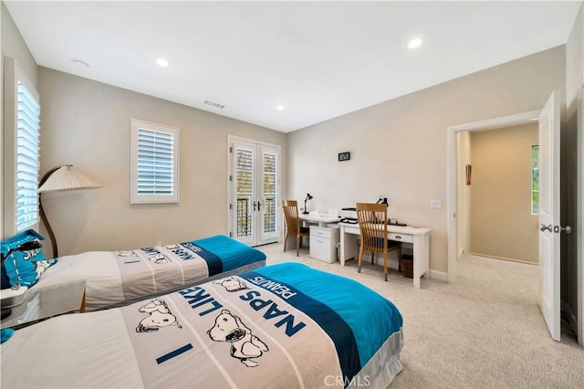 bedroom featuring light carpet, access to exterior, and french doors