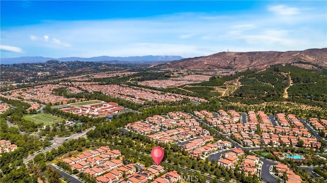 birds eye view of property featuring a mountain view