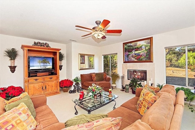 carpeted living room featuring ceiling fan