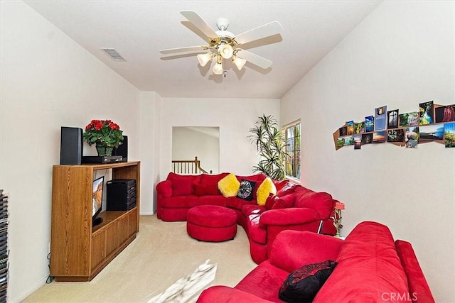 living room featuring ceiling fan and carpet floors