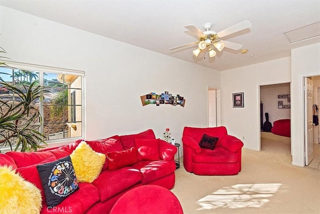 carpeted living room with ceiling fan