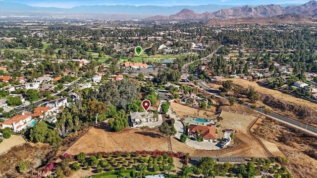 birds eye view of property featuring a mountain view