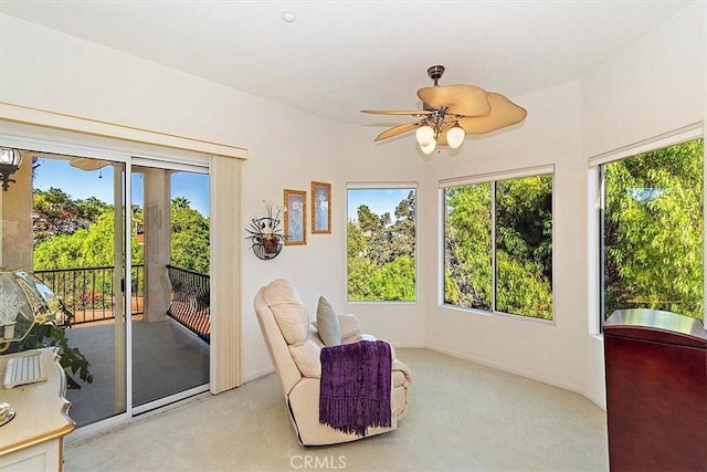 sunroom featuring ceiling fan