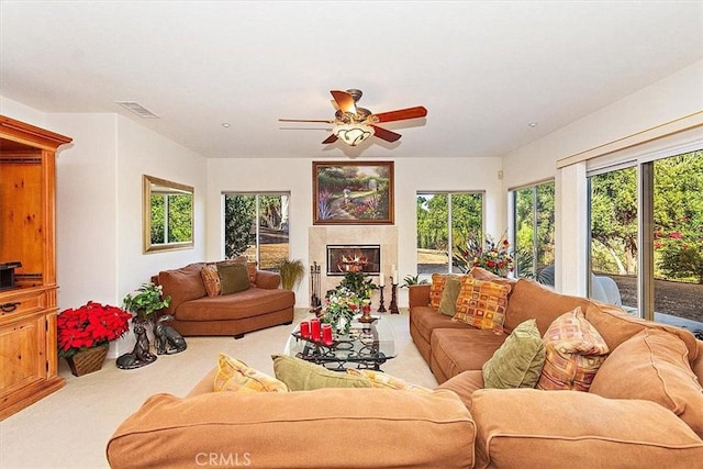 living room with ceiling fan and light carpet