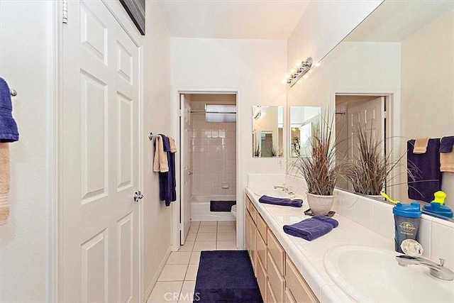 bathroom with tile patterned floors, vanity, and toilet