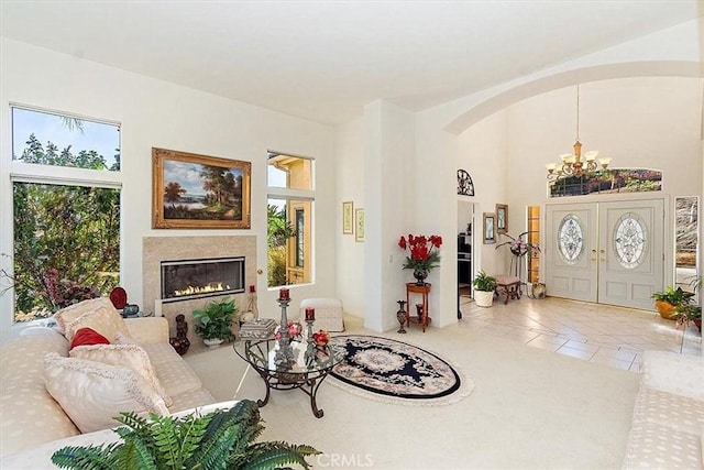 living room featuring a chandelier and tile patterned flooring