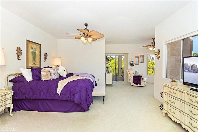 carpeted bedroom featuring access to outside and ceiling fan