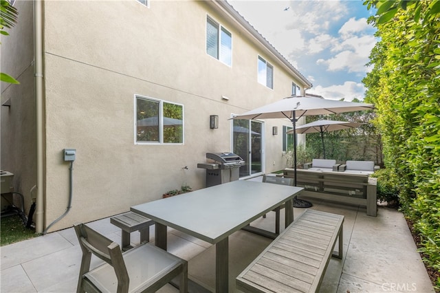 view of patio featuring a grill and outdoor lounge area