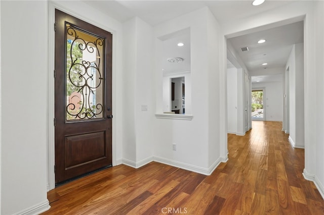 foyer entrance with hardwood / wood-style floors