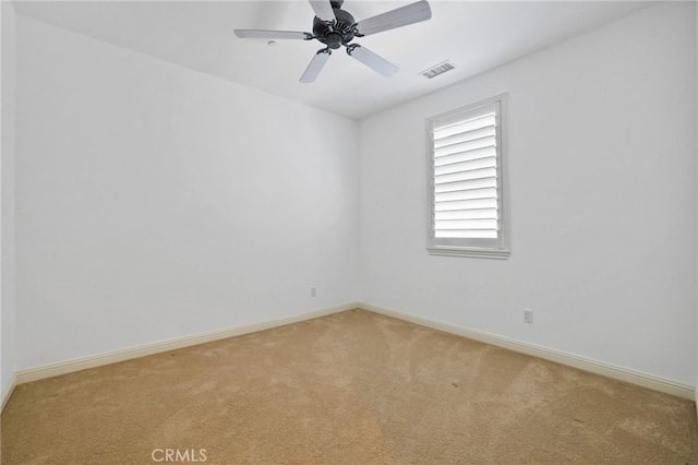 carpeted empty room with ceiling fan