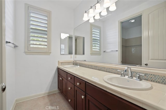 bathroom with tile patterned floors and vanity