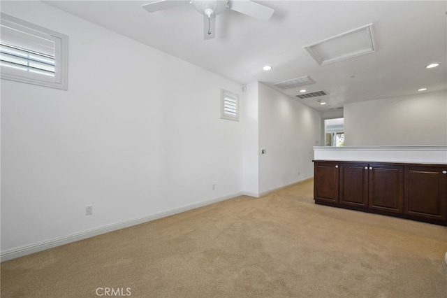 empty room featuring light carpet and ceiling fan