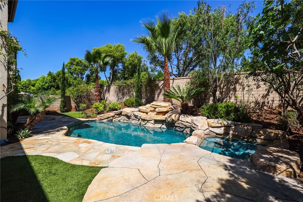 view of swimming pool with a patio area