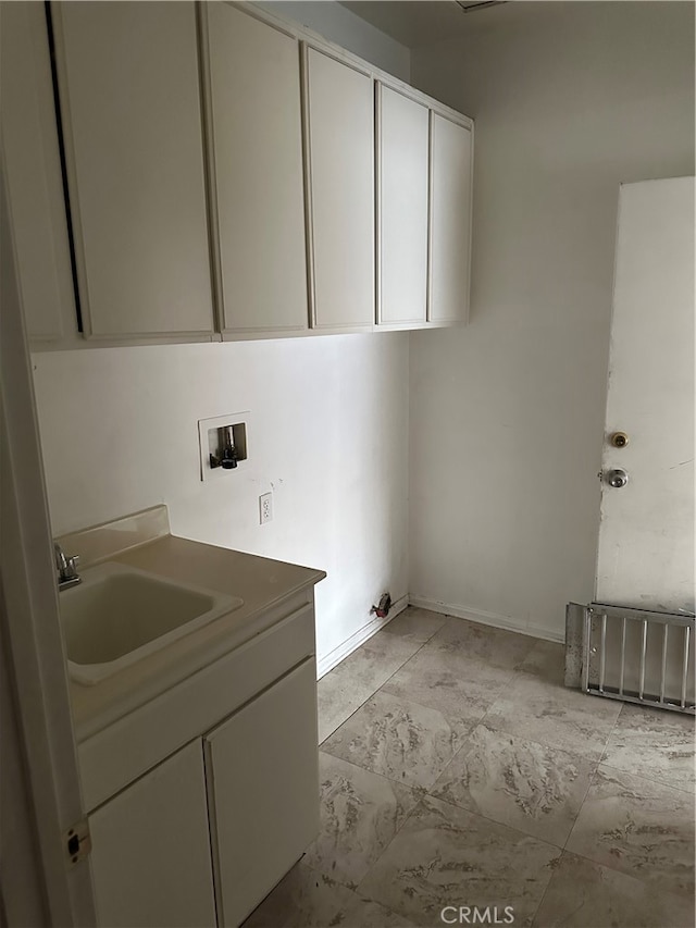 laundry area with sink, washer hookup, and cabinets