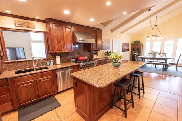 kitchen featuring a wealth of natural light, sink, stainless steel appliances, wall chimney range hood, and lofted ceiling with beams