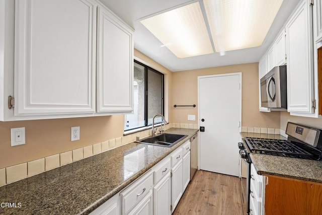 kitchen featuring white cabinetry and stainless steel appliances