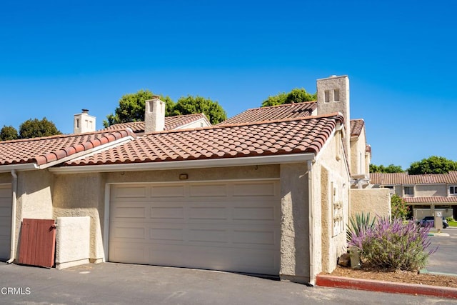 mediterranean / spanish-style house featuring a garage