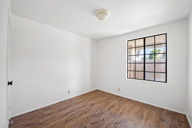 unfurnished room featuring wood-type flooring