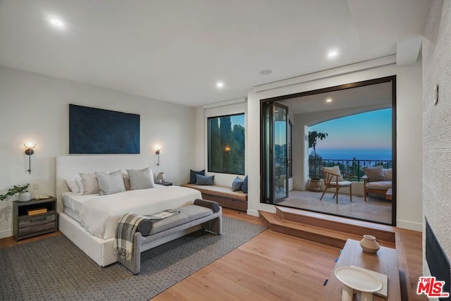 bedroom with hardwood / wood-style floors