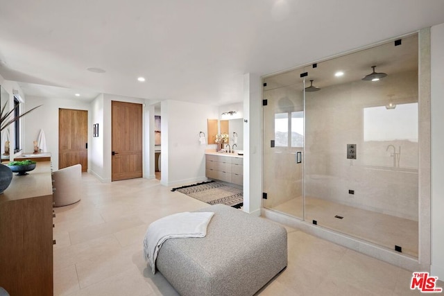 bathroom featuring vanity and an enclosed shower