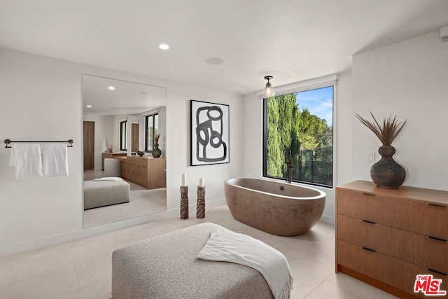 bathroom featuring a bathing tub and vanity