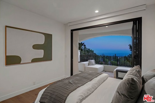 bedroom with wood-type flooring