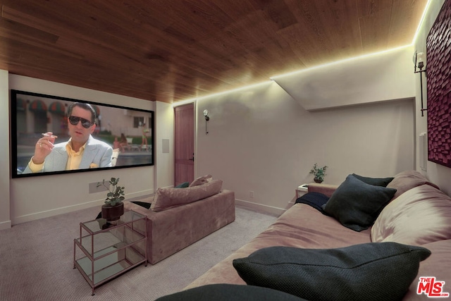 cinema room featuring light colored carpet and wood ceiling