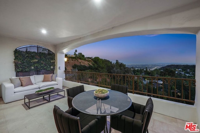 patio terrace at dusk with an outdoor living space