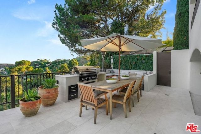 view of patio featuring a grill