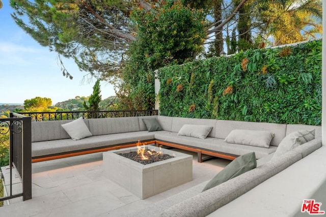 view of patio with a fire pit