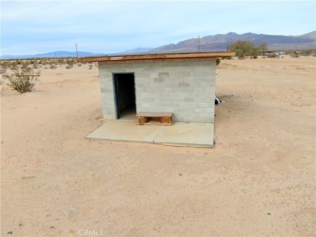 view of outdoor structure with a mountain view