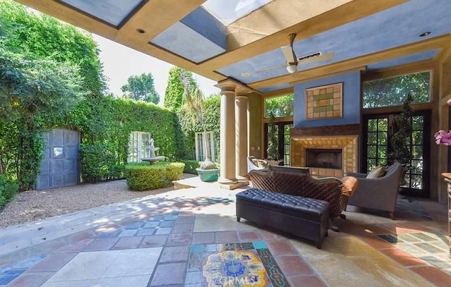 view of patio / terrace with an outdoor fireplace