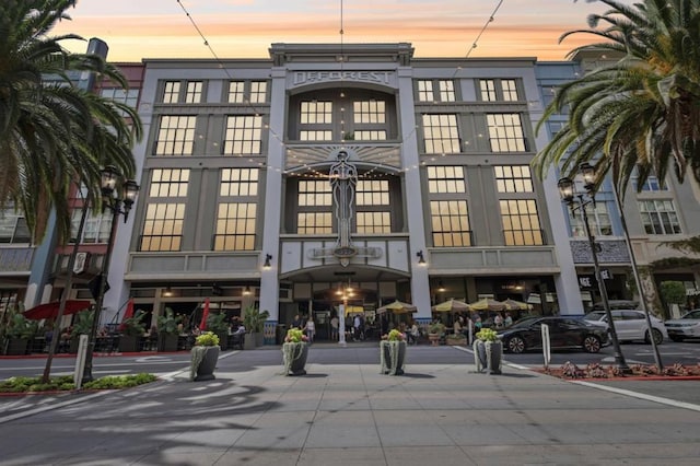 view of outdoor building at dusk