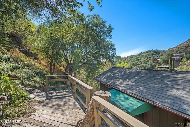 wooden deck featuring a mountain view