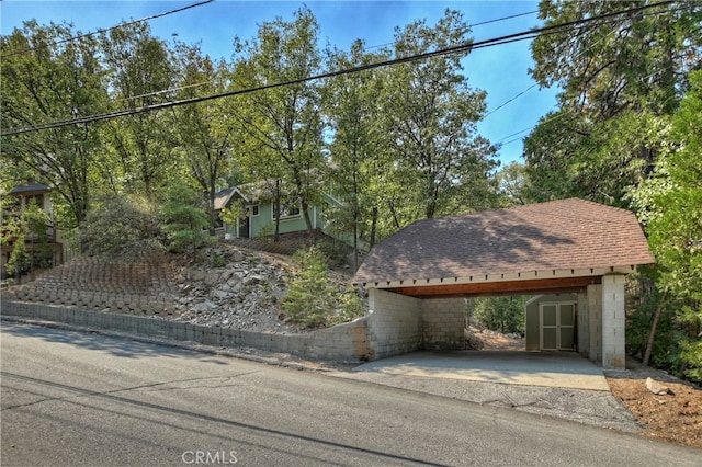 view of front of home featuring a carport