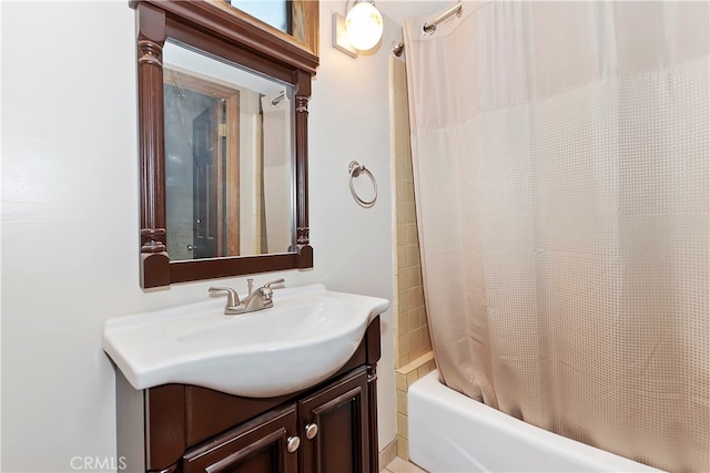 bathroom featuring vanity and shower / bath combo with shower curtain