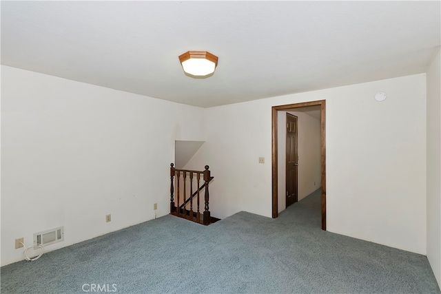 spare room featuring carpet flooring