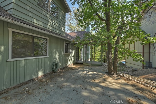 view of side of home featuring a patio