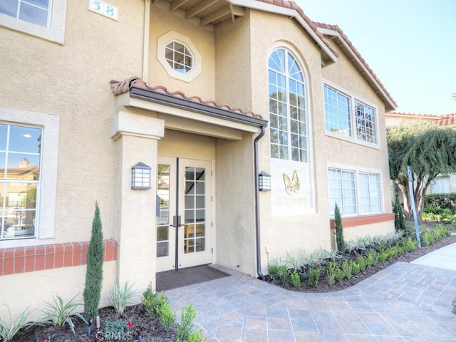 property entrance featuring french doors