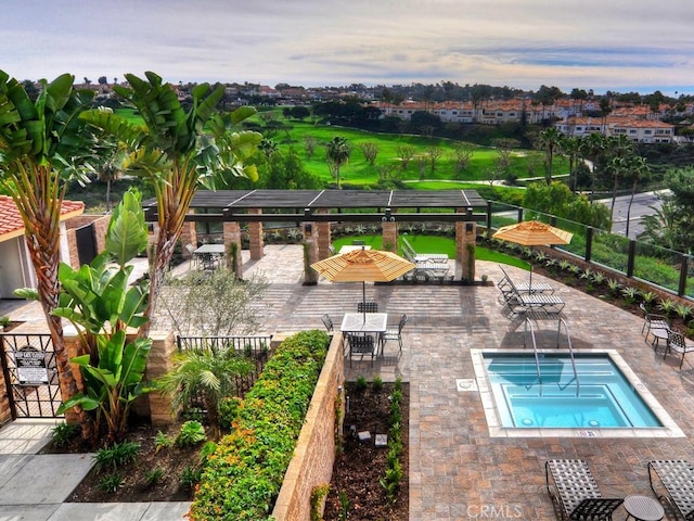 pool at dusk featuring a patio area