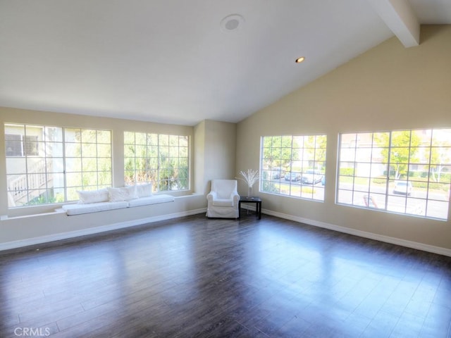 unfurnished room featuring beamed ceiling, dark hardwood / wood-style floors, high vaulted ceiling, and a wealth of natural light