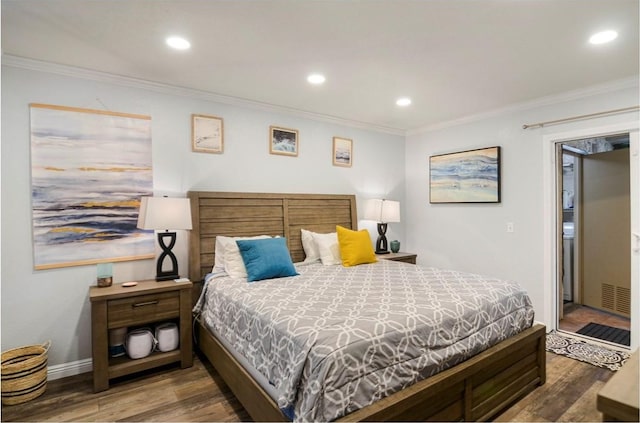 bedroom with hardwood / wood-style flooring and crown molding