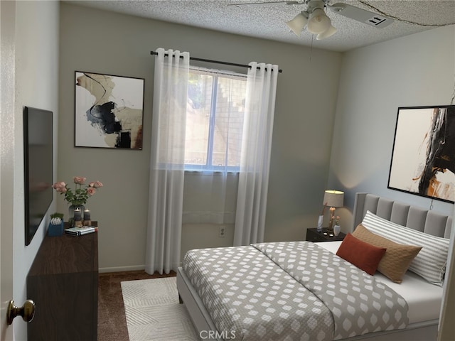 carpeted bedroom with a textured ceiling