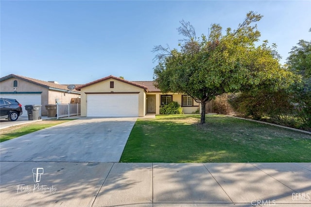 ranch-style house featuring a front yard and a garage